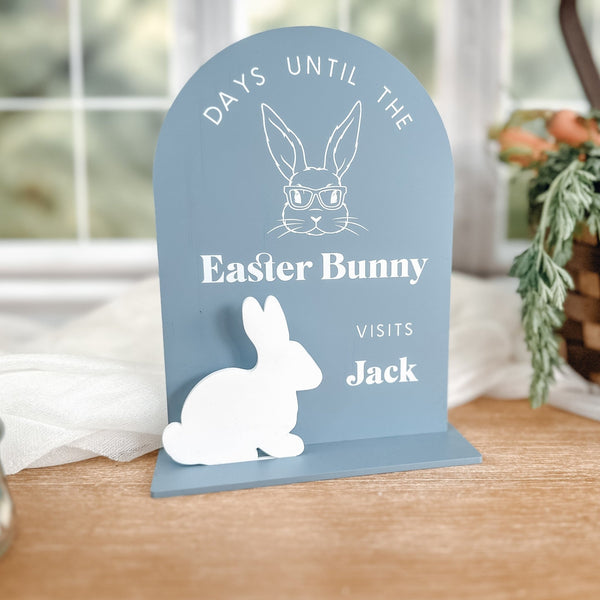 Easter countdown sign with bunny design, featuring 'Days Until the Easter Bunny Visits Jack' text, in blue acrylic with white bunny silhouette